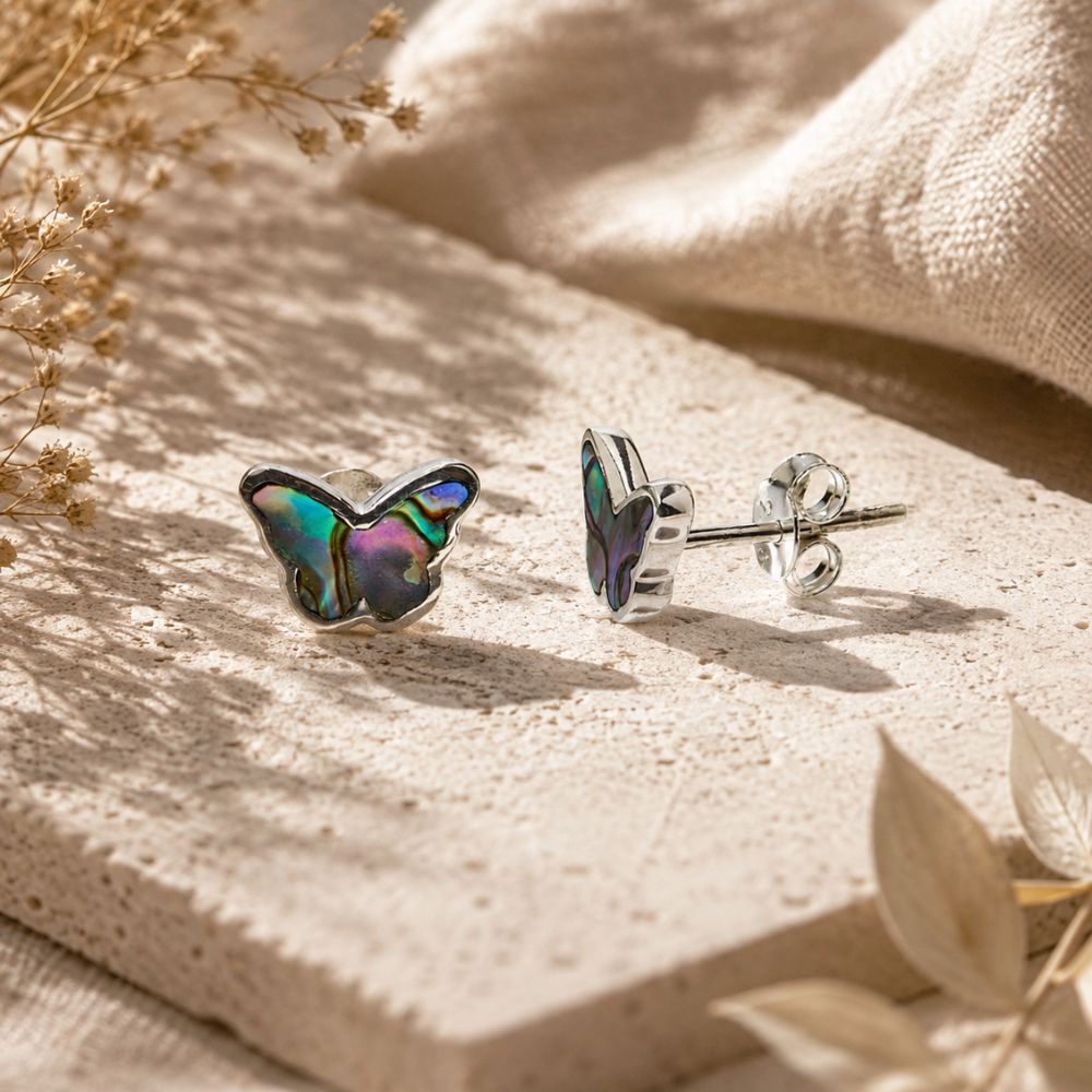 Abalone butterfly silver stud earrings with colorful iridescent shell inlay.