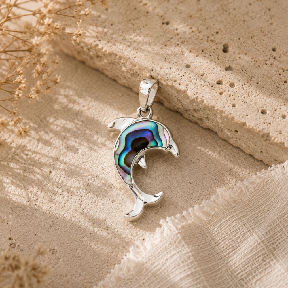 Abalone Shell Dolphin Pendant with iridescent abalone shell in a polished silver dolphin design.