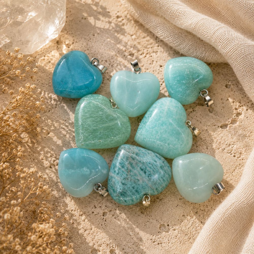 Turquoise heart-shaped beads on a beige fabric background