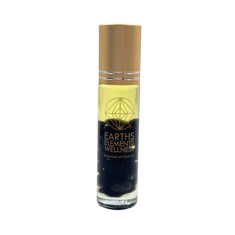 Bottle of Earths Elements Wellness essential oil roll-on with gold cap on a white background