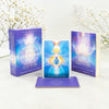 Two books titled 'Angelic Lightwork' by Alana Fairchild on a white surface with decorative elements.
