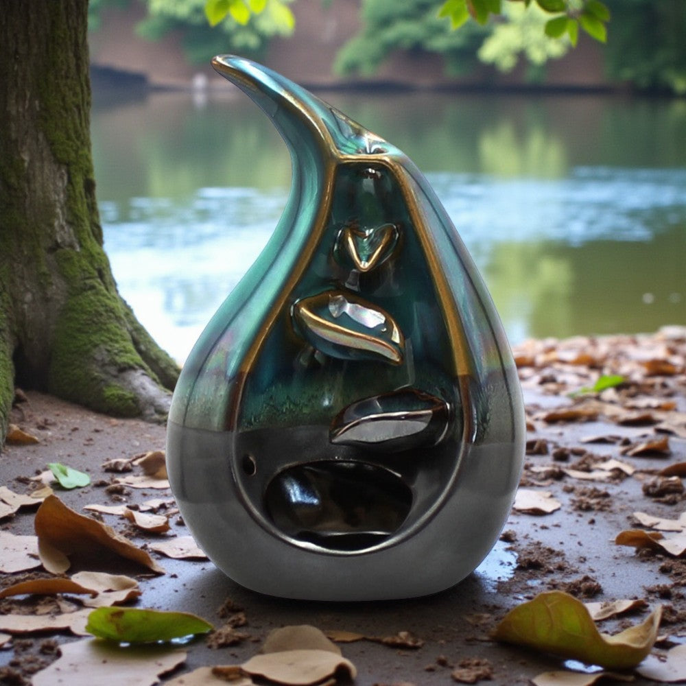 Decorative back flow incense holderwith leaf design by a lake