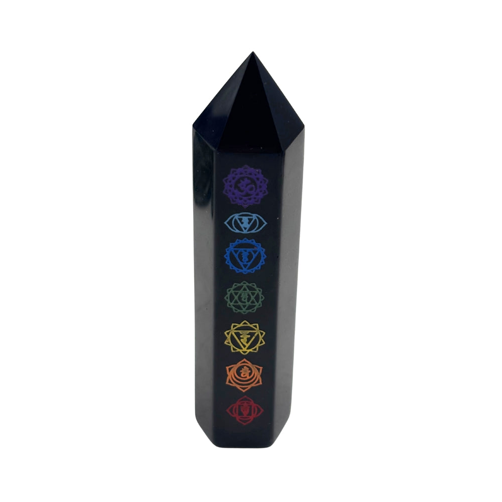 Black crystal tower with chakra symbols on a white background