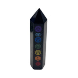 Black crystal tower with chakra symbols on a white background