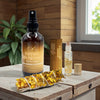 Infinite Abundance Spray, roll-on and yellow flower sage on a wooden table