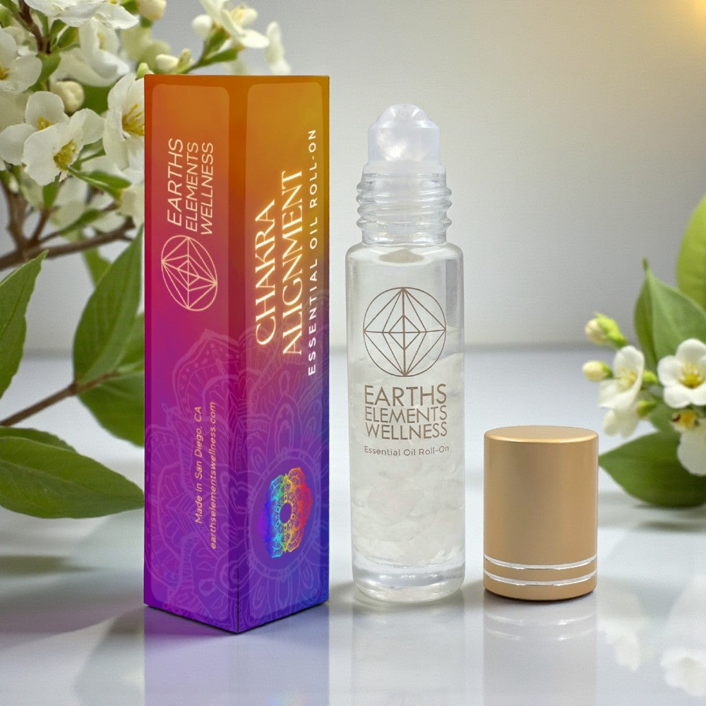 Earth's Elements Wellness Chakra Alignment essential oil roll-on with packaging on a light background.