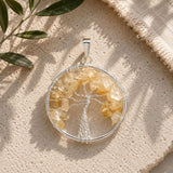 Citrine Crystal Tree of Life Silver Pendant with natural citrine gemstone chips on a handcrafted sterling silver tree design.