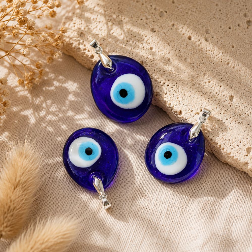 Evil Eye Glass Pendant with a traditional blue evil eye design and silver bail.