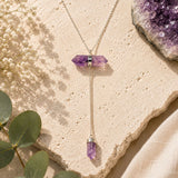 Amethyst Y necklace with horizontal double-point crystal and dangling amethyst point on silver chain.