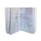 Open book with mystical illustrations and text on a white background