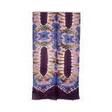 Tie-dye patterned scarf with purple, blue, and green colors on a white background