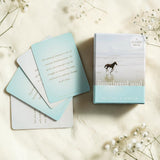 The untethered soul card deck with cards spread out on a light surface.