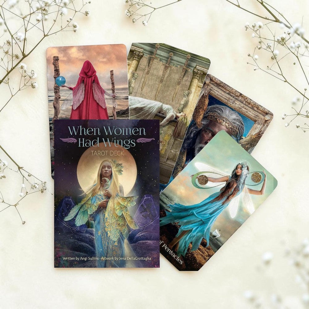 Tarot cards and book titled 'When Women Had Wings' on a light background with decorative elements.