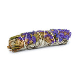 White sage bundle wrapped with purple flowers