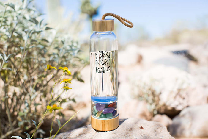 Crystal water bottle on a rock