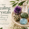 Healing crystals including Amethyst, Clear Quartz, Amber, Jade, Aquamarine and Pyrite arranged on a natural stone tray.