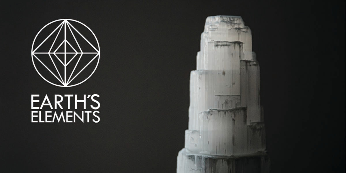 Selenite tower with the Earths Elements Logo