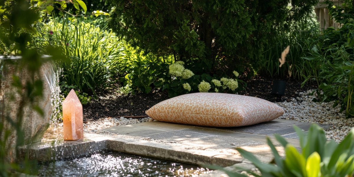 peach colored crystal pillar by an outdoor fountain