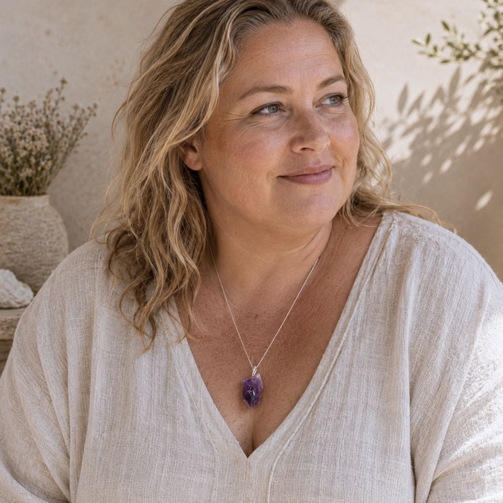 Woman wearing an Aura Amethyst Raw Pendant necklace