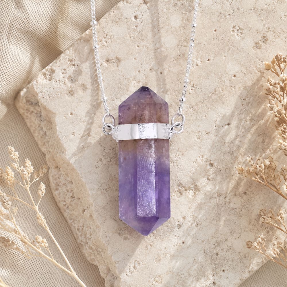 Amethyst Double Terminated Crystal Necklace with a faceted natural amethyst point and silver chain.