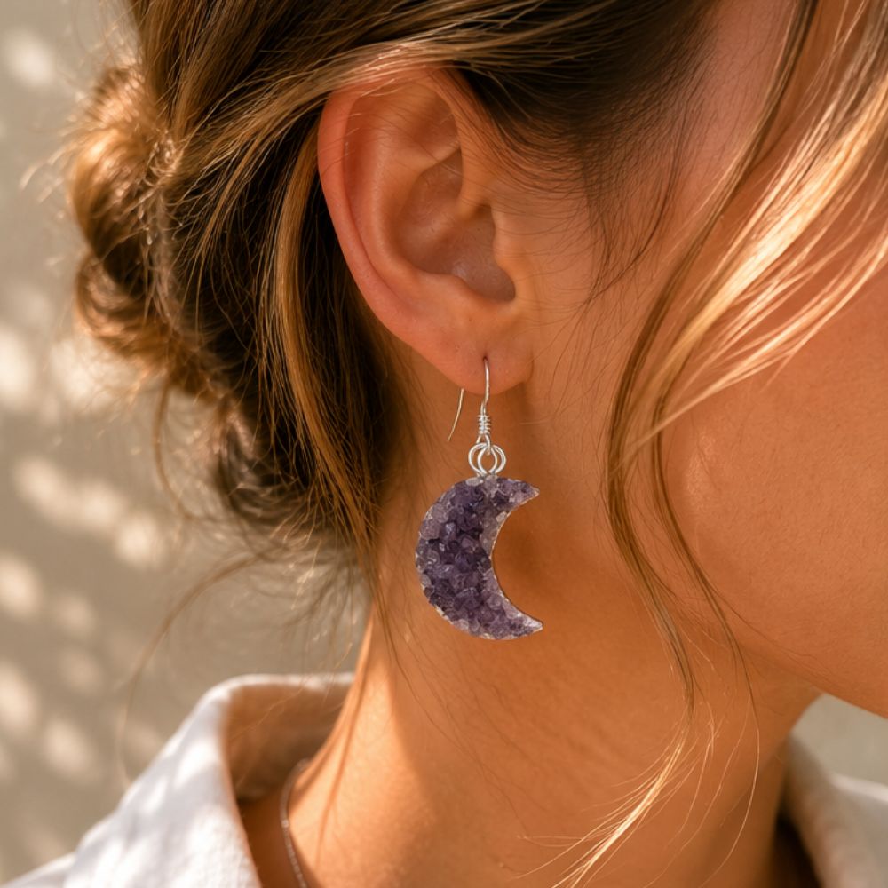 woman wearing half moon earring
