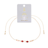 Bracelet - Zodiac, Cancer with red and pink beads on a white background