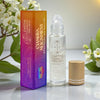 Earth's Elements Wellness Chakra Alignment essential oil roll-on with packaging on a light background.