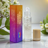 Earth's Elements Wellness Chakra Alignment essential oil roll-on with packaging on a light background.