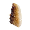 Citrine crystal with brown and beige colors on a white background