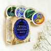 Crystal Medicine Oracle cards with colorful illustrations on a white background
