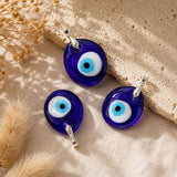 Evil Eye Glass Pendant with a traditional blue evil eye design and silver bail.