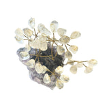Decorative wall light fixture with crystal-like beads on a white background