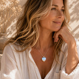 Woman wearing an Opalite mini heart pendant necklace