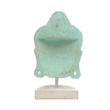 Decorative Buddha head sculpture with a distressed finish on a white background