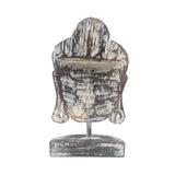 Wooden Buddha head sculpture on a white background