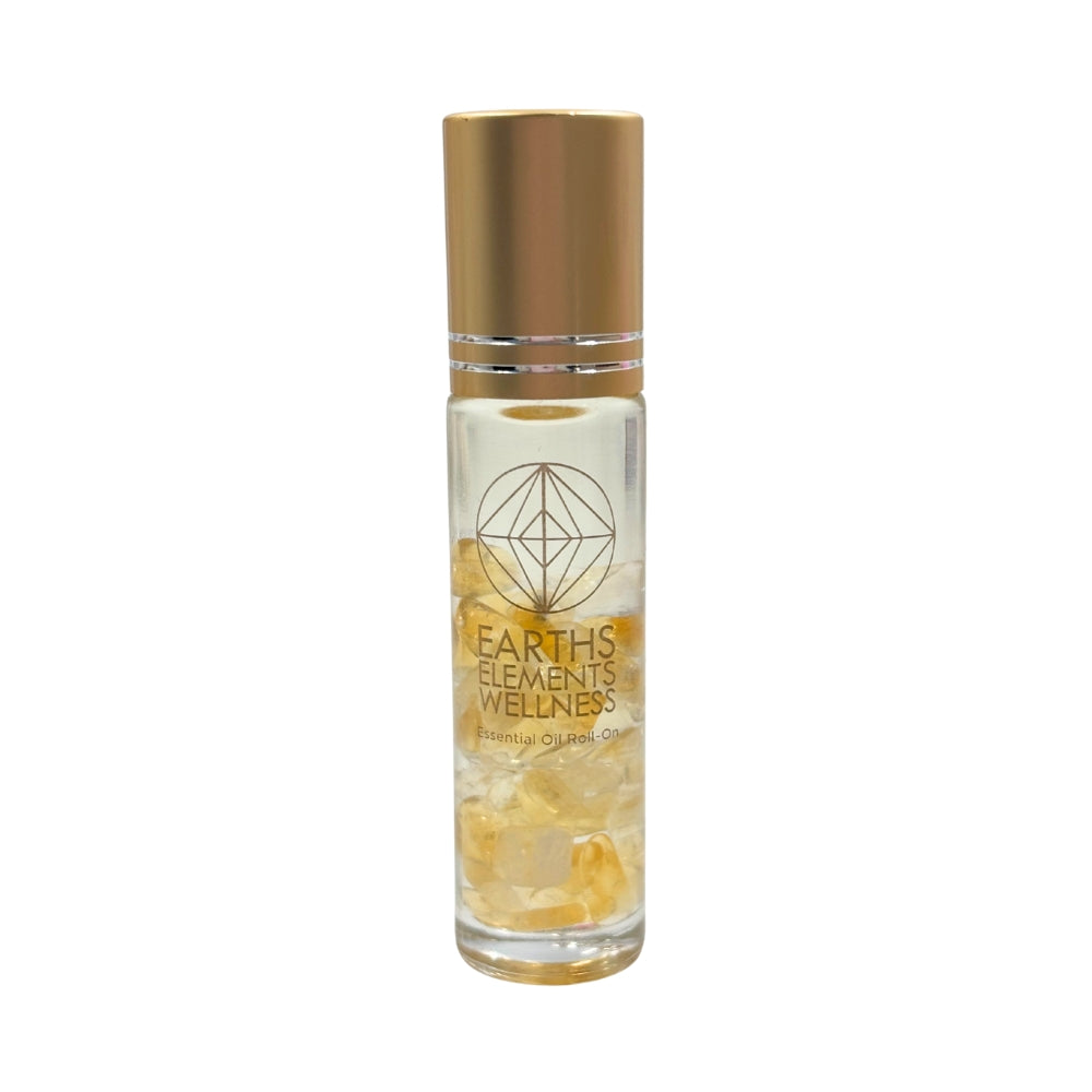 Bottle of Earth's Elements Wellness essential oil roll on with gold cap on a white background