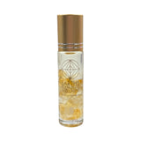 Bottle of Earth's Elements Wellness essential oil roll on with gold cap on a white background