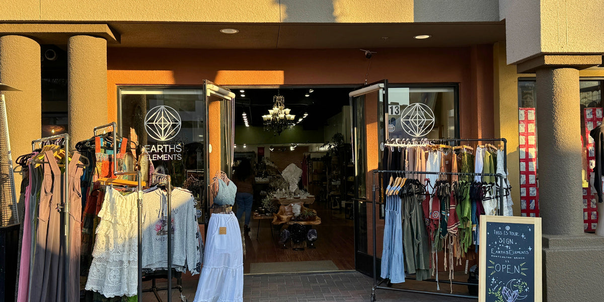store front Earths Elements Huntington Beach with racks of clothing outside