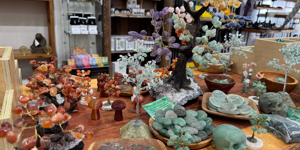 close-up of table with a variety of crystals and crystal trees