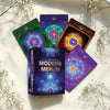 Modern Merlin Oracle cards on a light surface with white flowers