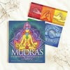 Mudras book set with colorful cards on a light background