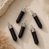 Shungite point pendant with silver cap and bail on matching chain.
