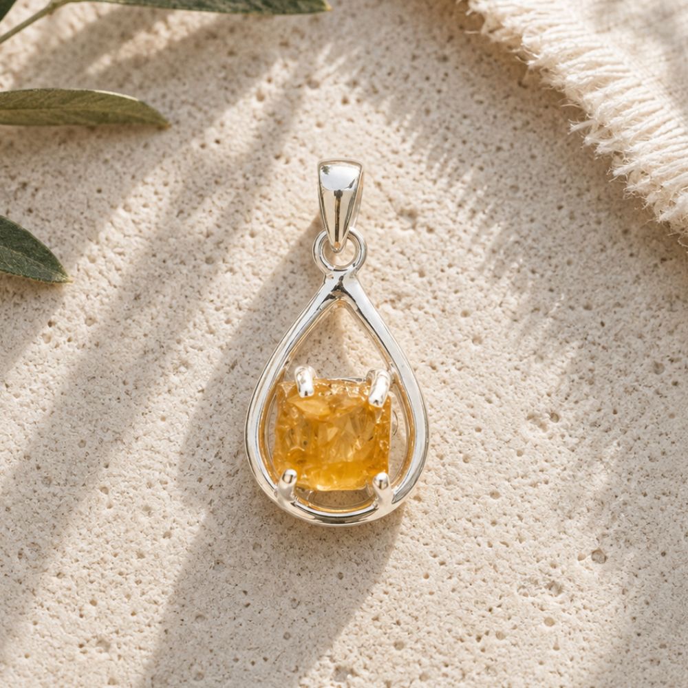 Raw Citrine Silver Teardrop Pendant with natural rough citrine crystal in an open sterling silver setting.