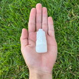 hand holding a mini selenite tower 