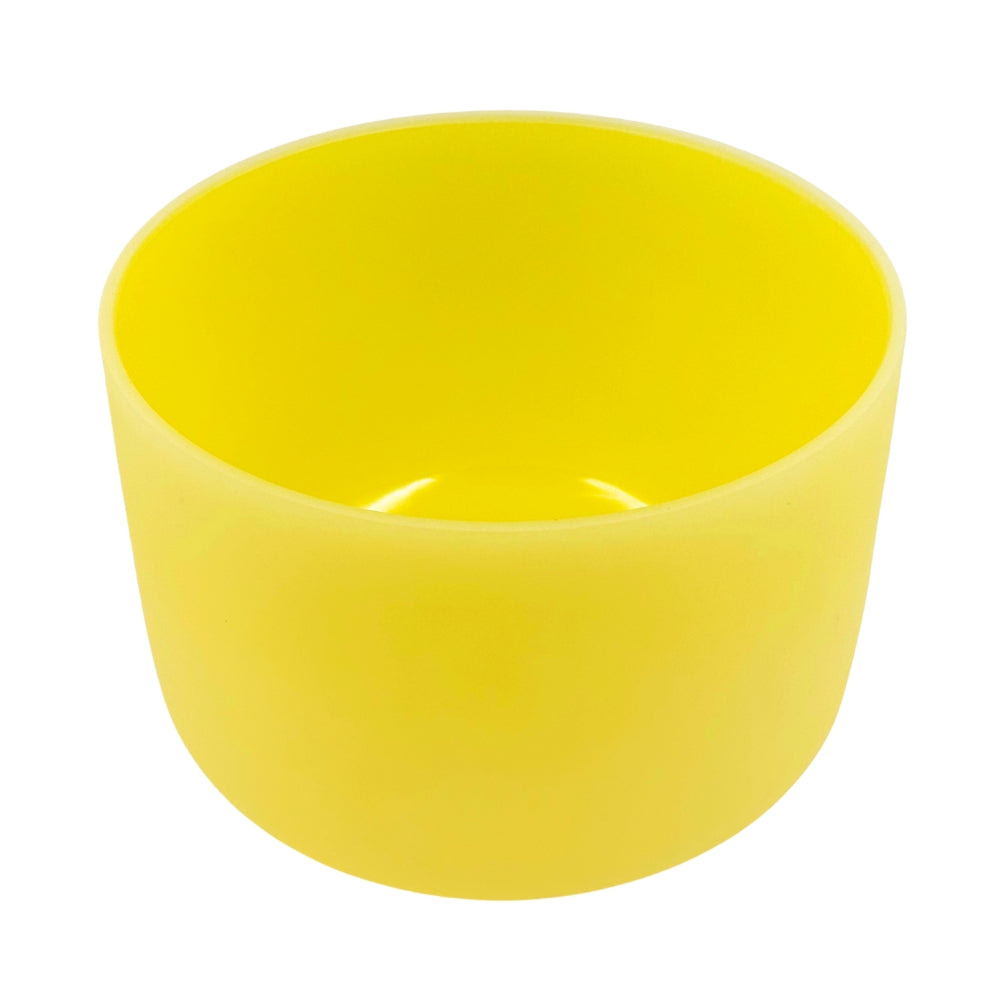Yellow singing bowl on a white background