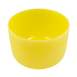 Yellow singing bowl on a white background