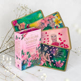 Set of 'The Unfurling Goddess' oracle cards with a box on a light background
