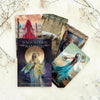 Tarot cards and book titled 'When Women Had Wings' on a light background with decorative elements.
