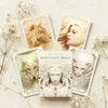 White Light Oracle cards with animals and a woman on a light background