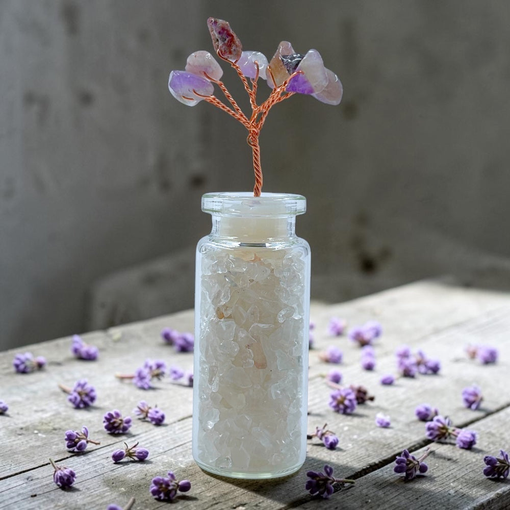 Wishing Jar Spirituality - Clear Quartz with scattered flowers on a wooden surface.